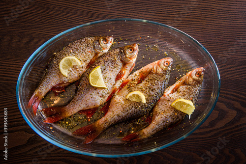 European perch fish, Perca fluviatilis. Prepared for cooking with spicies and lemon.