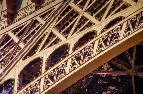 Slanted view of the Eiffel Tower in Paris, detailed view of the iron structures. High quality photo
