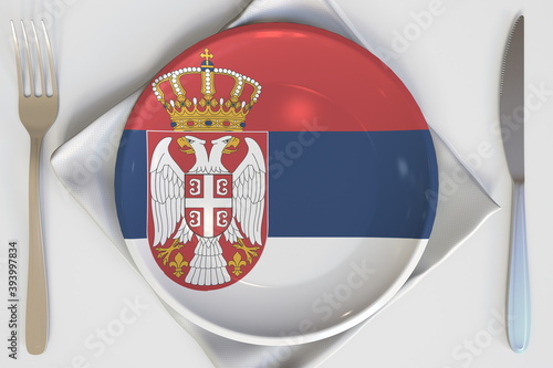 Plate with flag of Serbia on the table, national cuisine conceptual 3d rendering