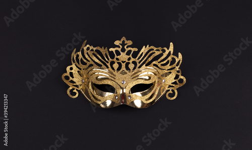 golden masquerade mask isolated on black background