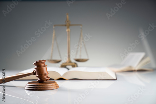 Law and justice concept. Gavel, legal code and scale on the off-white background.