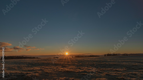 Rybnik village with pasture land in frosty color morning in sunrise time