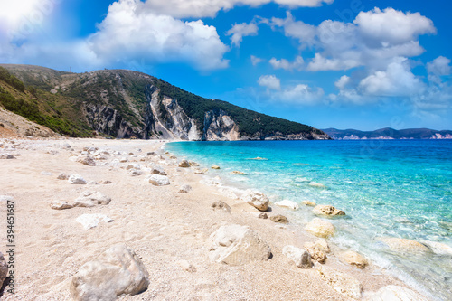 The beautiful beach of Myrtos on the Ionian island of Kefalonia, Greece, with soft tones pebbles and rocks and turquoise sea, without people