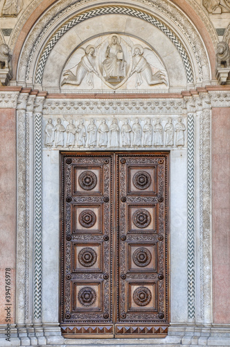 Main door entrance of San Martino Cathedral in Lucca, Tuscany, Italy