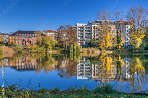 Park Lietzensee and buildings on the shore of Lake Lietzen in Berlin, Germany