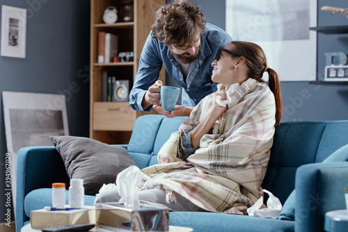 Husband taking care of his sick wife at home