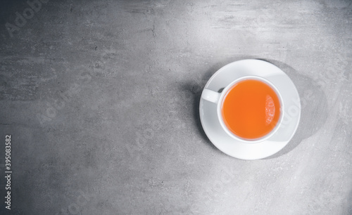 Cup of tea isolated on gray background. Top view, above