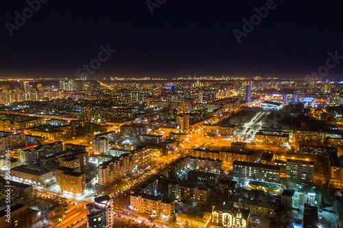 Aerial view of the night modern city. Bright lights of the night streets. Ekaterinburg. Russia