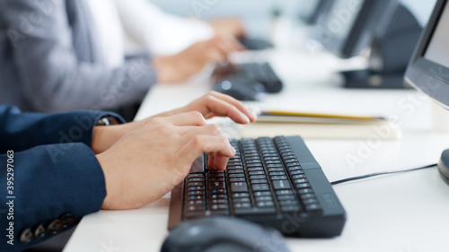 Closeup business people hands typing on keyboard computer desktop for using internet, searching data, working, writing email.