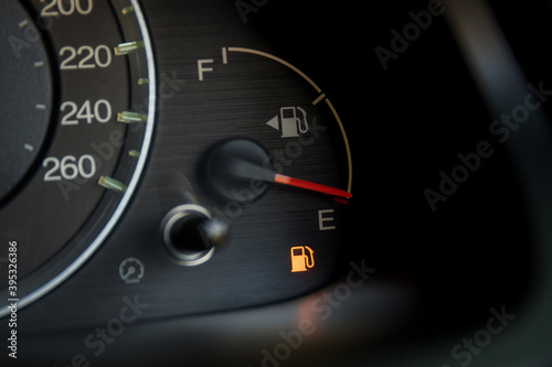 Empty fuel warning light in car dashboard. Fuel pump icon. gasoline gauge dash board in car with digital warning sign of run out of fuel turn on. Low level of fuel show on speedometer dashboard.