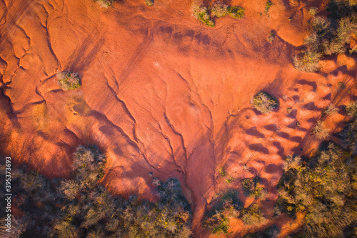 Gant, Hungary - Aerial view of abandoned bauxite mine, bauxite formation, the red mountains resembling Martian landscape. Red and orange colored surface, bauxite texture, warm autumn colors.