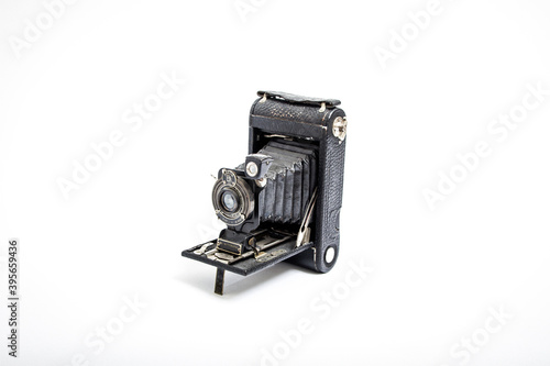 1910 vintage single-lens camera on white background