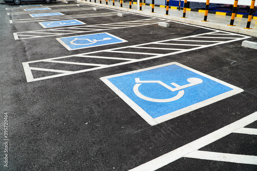 Multiple parking spaces reserved for disabled shoppers in retail parking lots. 
