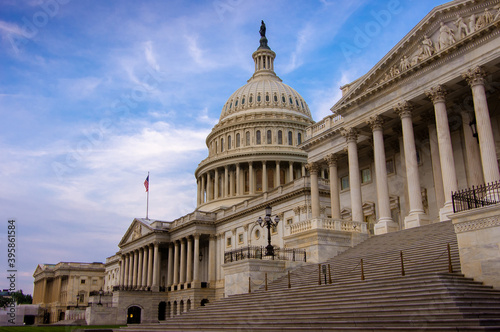 Low angle view of the east entrance to United States Capitol building in Washington DC with marble dome and stairs