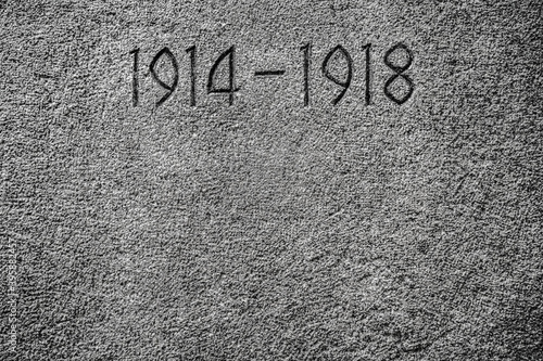 1914-1918 carved on a wall.Number 1914 on monument for the dead of the First World War. stone background texture.