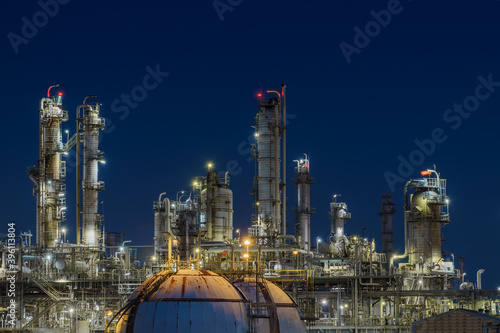 Glitter lighting of petrochemical plant at night, Manufacturing of Oil and gas refinery industrial, Close up of equipment petroleum industry