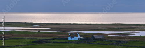Small cottage in the distance on South Uist, Outer Hebrides, Scotland, UK