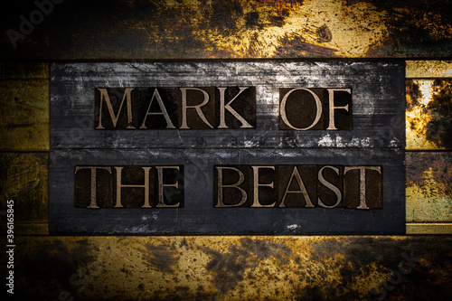 Mark Of The Beast text on textured grunge copper and vintage gold background