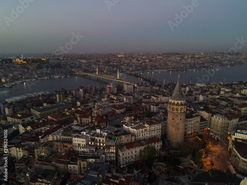 Aerial Galata Tower at Sunset. Galata Bridge and Golden Horn of Istanbul with beautiful colors at Sunset. 