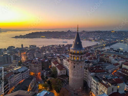 Aerial Galata Tower at Sunset. Galata Bridge and Golden Horn of Istanbul with beautiful colors at Sunset. 