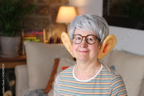 Senior woman with large ears