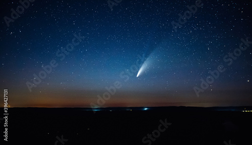 Wonderful view of starry sky and C/2020 F3 (NEOWISE) comet with light tail.