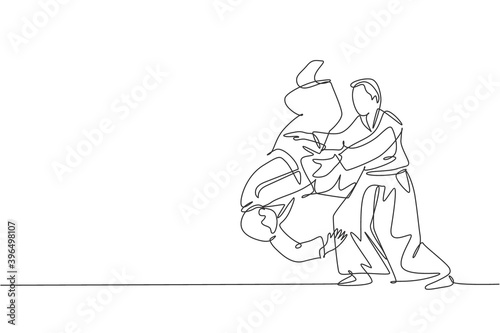 One single line drawing of two young energetic men wearing kimono exercise aikido slam technique in sports hall vector illustration. Healthy lifestyle sport concept. Modern continuous line draw design