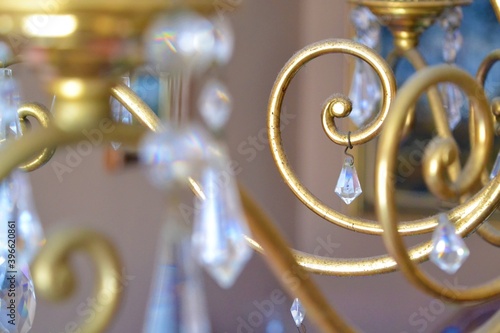 Detail shot of a golden chandelier with crystal tears