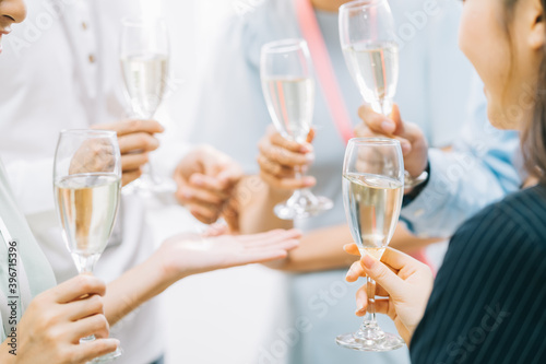 Group Asian business people are having a toast together and chatting at a company party