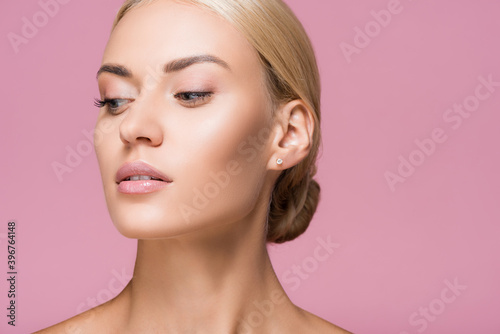 beautiful blonde woman with perfect skin isolated on pink