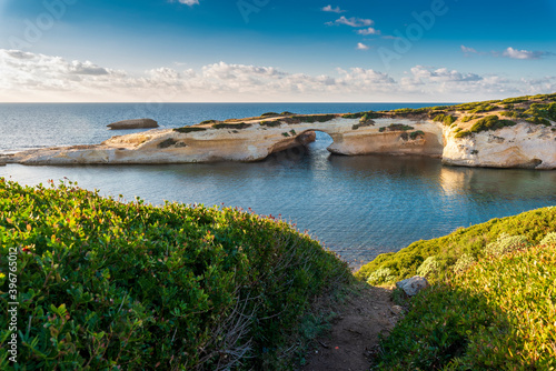 Limestone rock with arch, S'`Archittu di Santa Caterina in Oristano Province, Sardinia, Italy