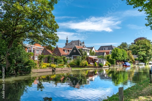 Reflection of houses in the river in Edam, Holland