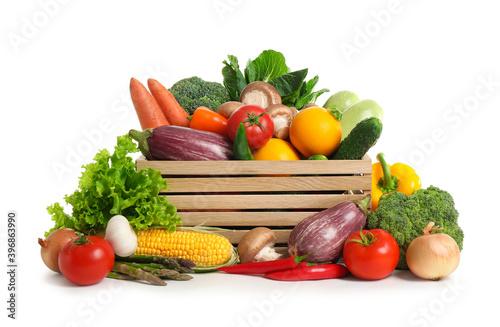 Wooden crate with fresh vegetables on white background