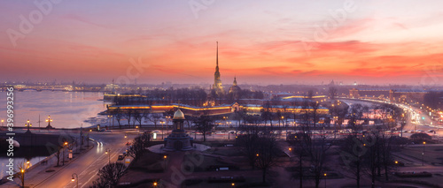 Early spring sunset panorama of Peter and Paul fortress in Saint-Petersburg, Russia, fog, street lights