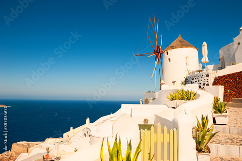 White architecture on Santorini island, Greece. Old windmill in Oia town. Travel destinations concept