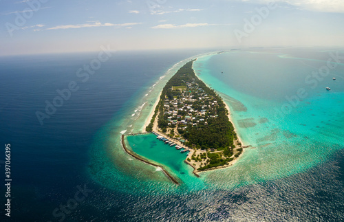 Aerial spherical panorama of tropical paradise beach on tiny Maldives island Dhigurah. Turquoise ocean, white sand, coconut palm trees.