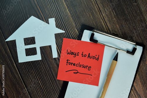 Ways to Avoid Foreclosure write on sticky notes isolated on Wooden Table.