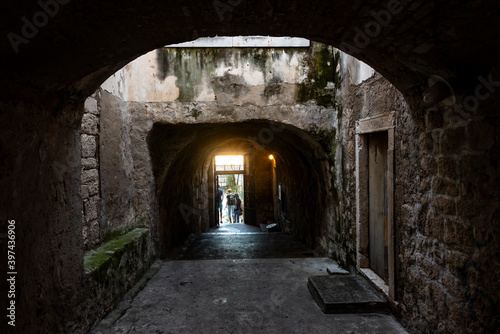 Fragment of the passage from the church between the medieval houses on the island of Korcula, Croatia