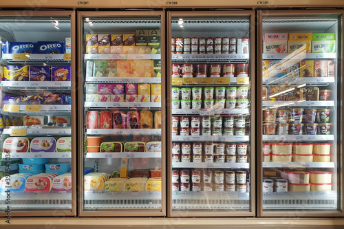 Interior view of huge glass freezer with various brand local and imported frozen food in Jaya Grocery store. KLIA2, MALAYSIA - 24 OCT 2019.