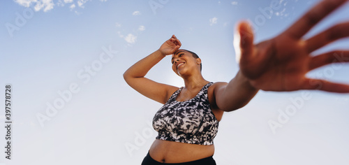 Plus size woman relaxing after workout