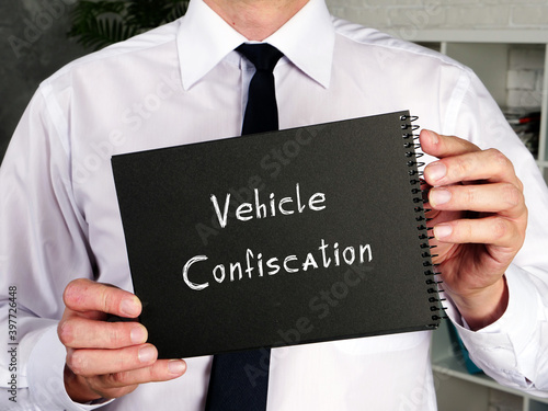 Business concept about Vehicle Confiscation with sign on the piece of paper.