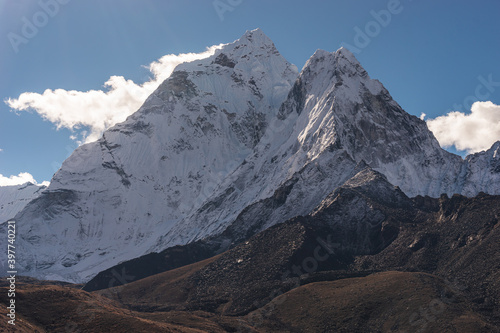 Ama Dablam mountain peak view from Dingboche village, Everest base camp trekking route, Himalaya mountains range in Nepal