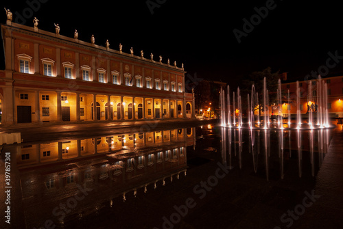 The Romolo Valli Municipal Theater in Reggio Emilia( Italy) with bright modern fountain