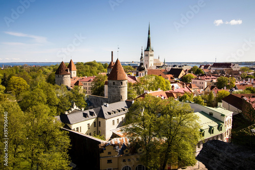 Panorama of medieval Tallinn city center during sunny day, port in the background