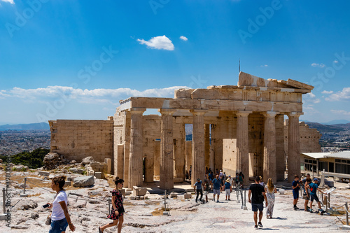 crowded with tourists acropolis of Athens. The main gateway, a propylaea, propylea or propylaia in sunny day