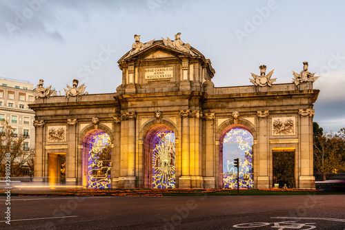 Puerta de Alcala in Madrid at sunset during Christmas