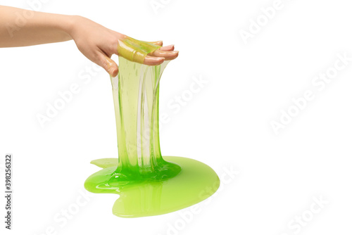 Green slime toy in woman hand isolated on white background.