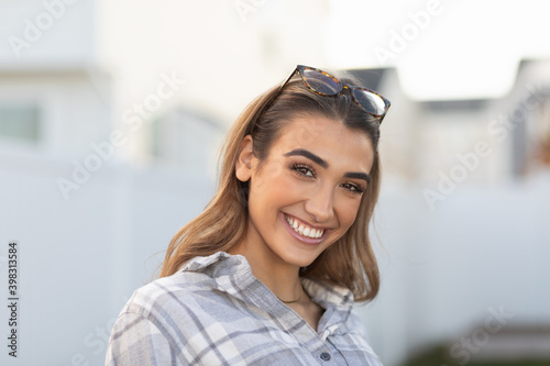 Smiling happy young woman in backyard 0310