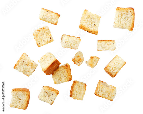 Wheat square croutons croutons falling on a white background. Isolated