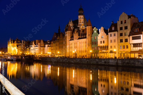 Picturesque Motlawa river embankment in old Polish town of Gdansk in twilight.